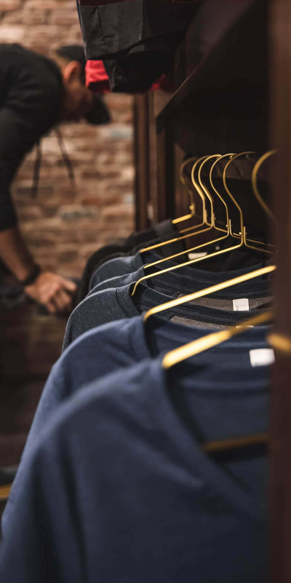 Go shirts on racks at taproom