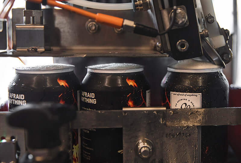 Go Brewing cans on our in-house canning line