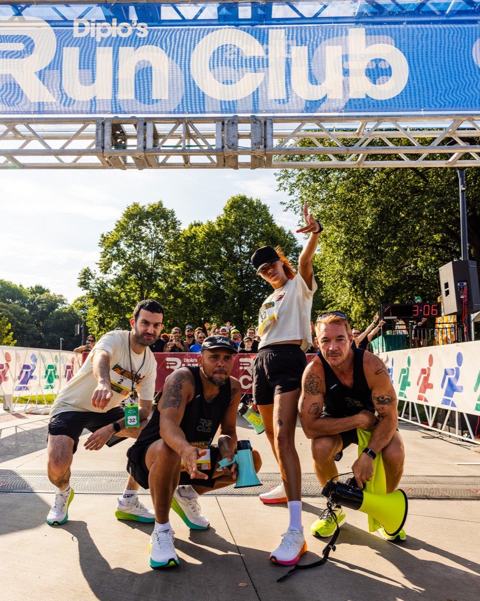 Diplo and crew under the Run Club arch in Philadelphia