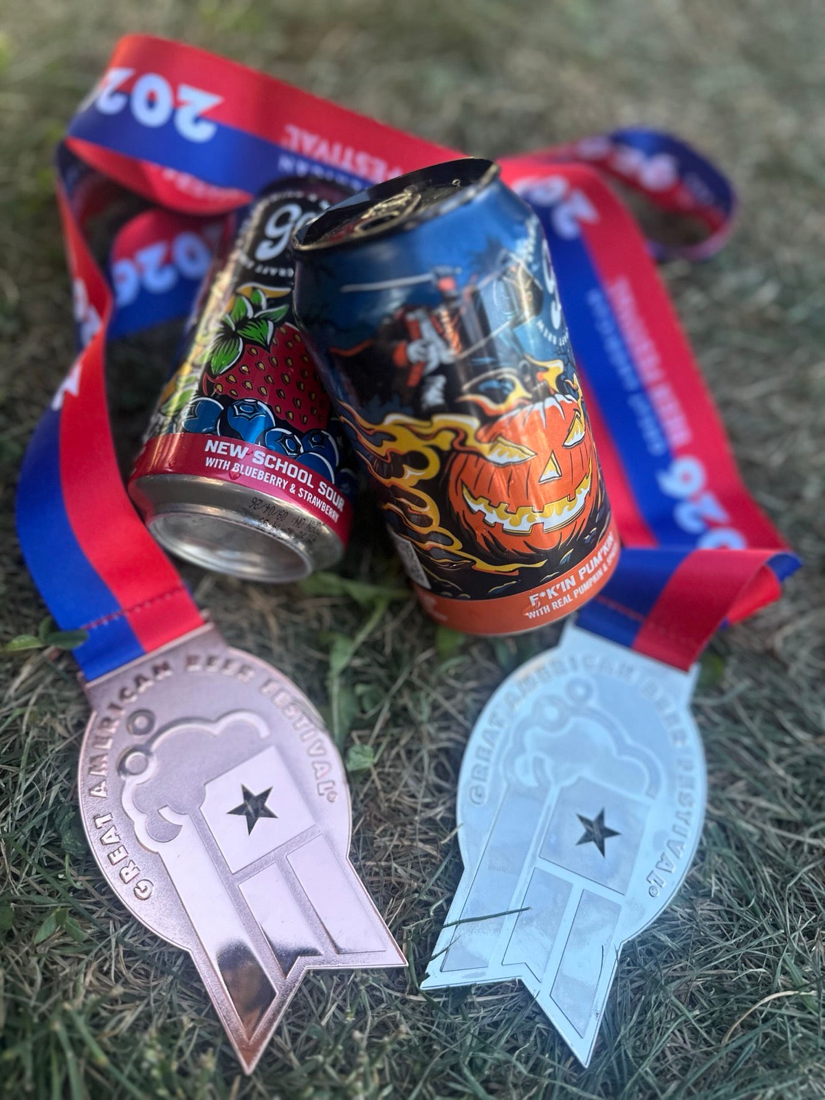 GABF 2026 silver and bronze medals with cans of F*k'in Pum'kin and New School Sour